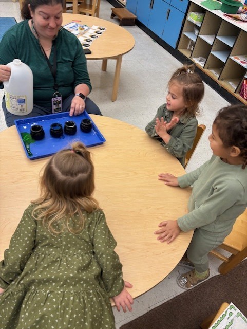 Students doing an activity with their teacher.