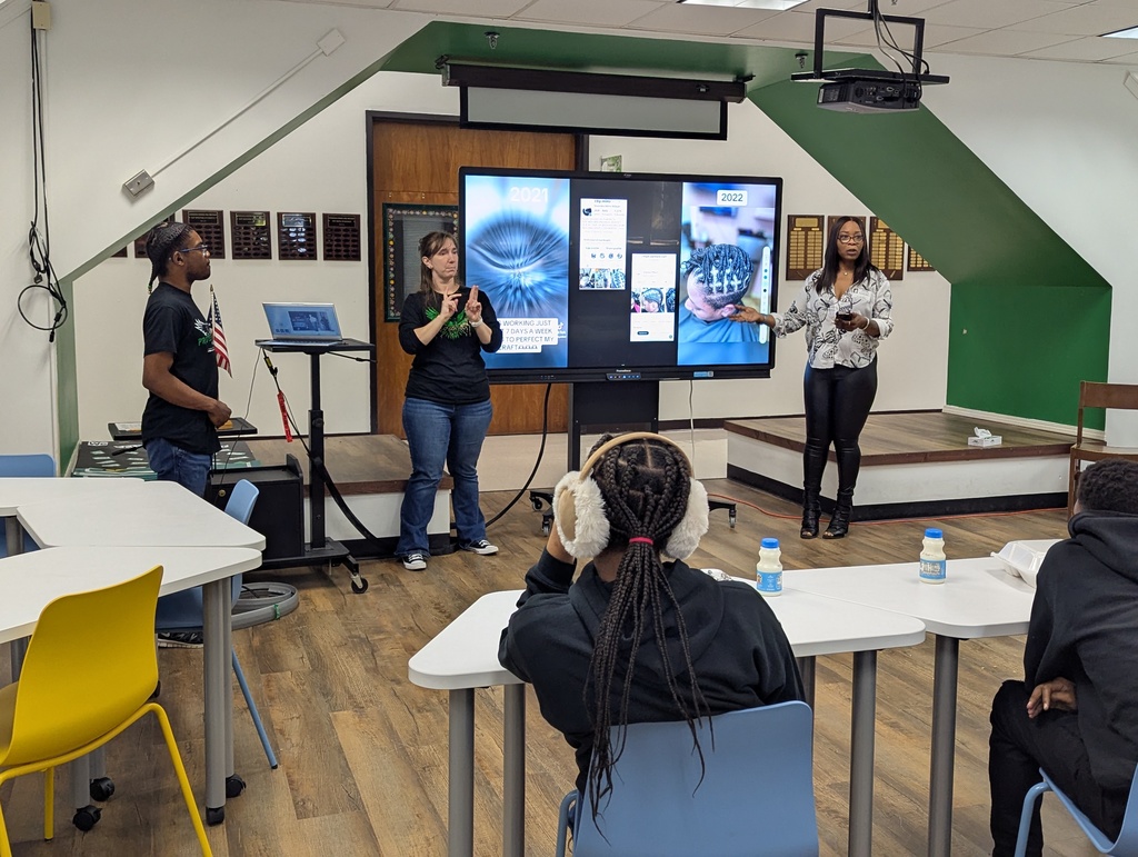Presenter at the front with an interpreter