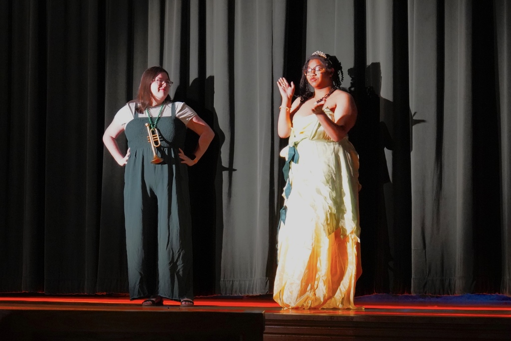 Student and staff on stage 