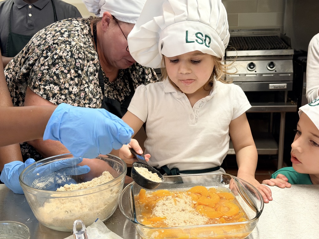 student adding ingredients in a dish