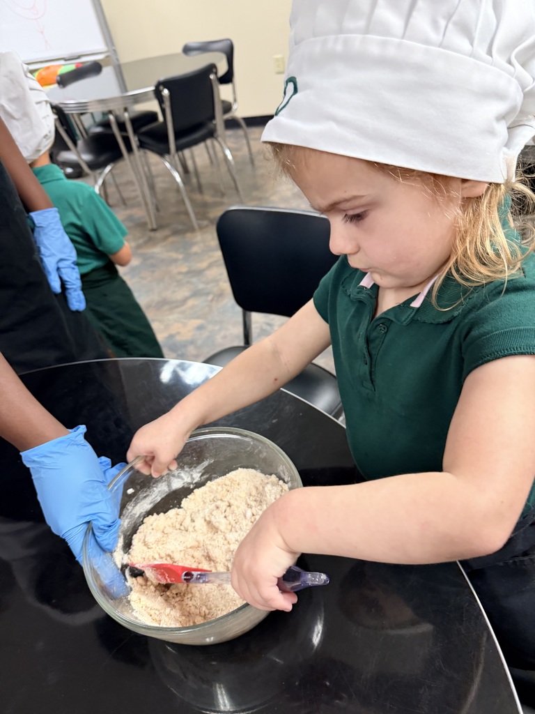 Student stirring ingredients in a bowl