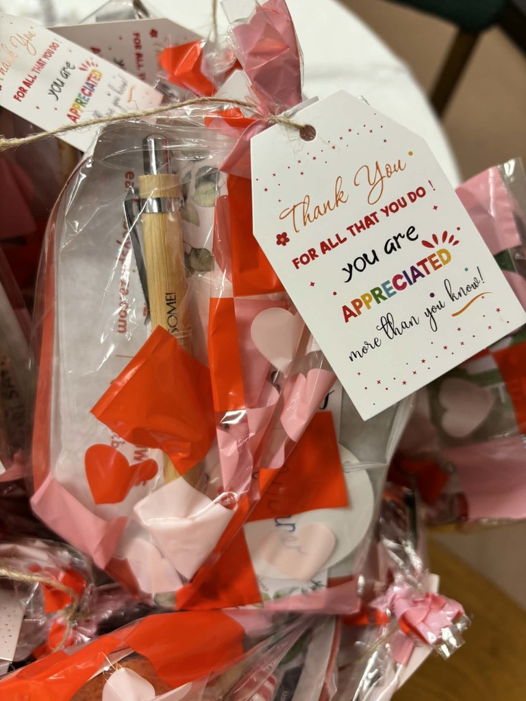 Goody bag with a card that reads 'thank you for al that you do, you are appreciated more than you know!"