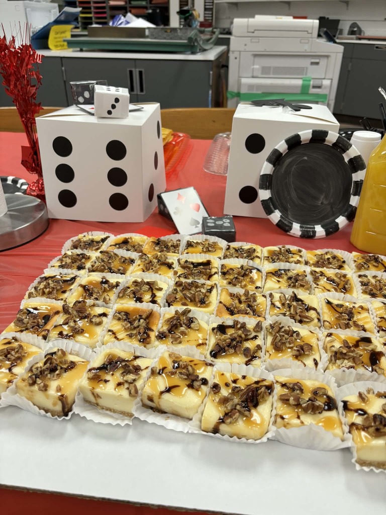 Mini cheesecakes are pictured, in front of casino themed decor