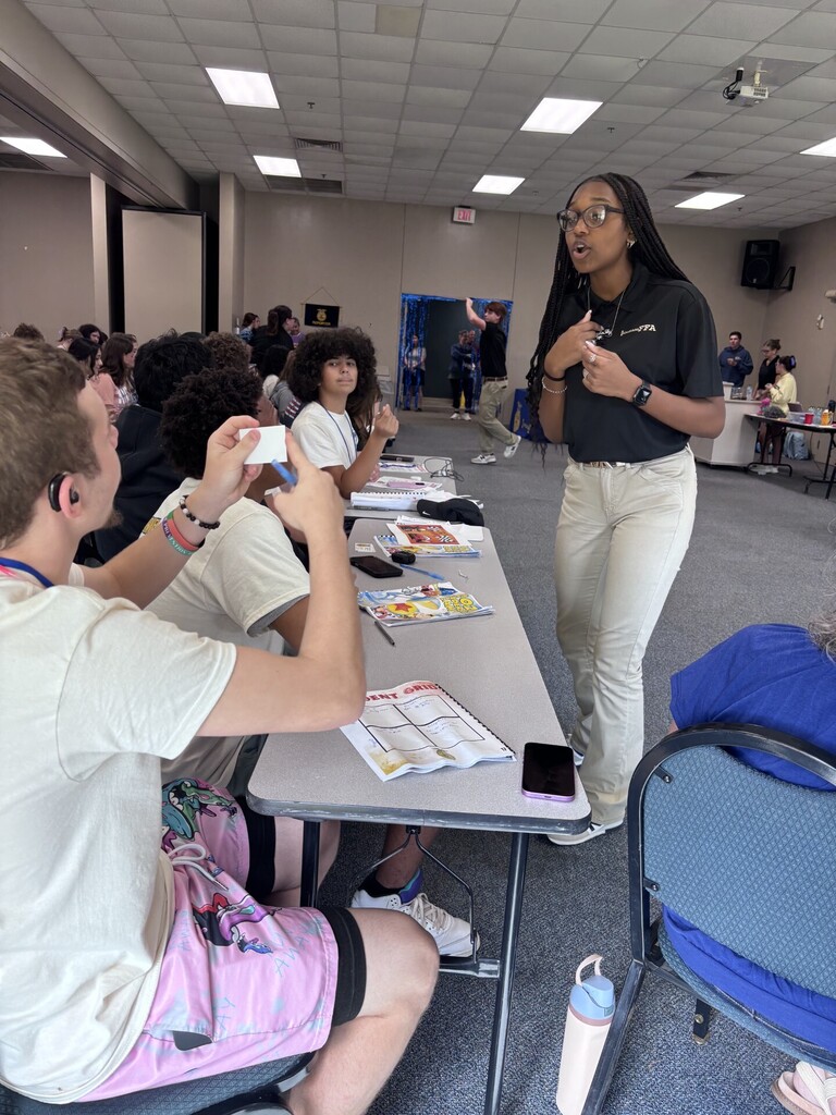 Student holding up a card