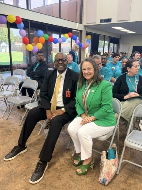 Bernel Cook and Sandy Holllaway pose for a picture in the front row at the SSD back to school event.