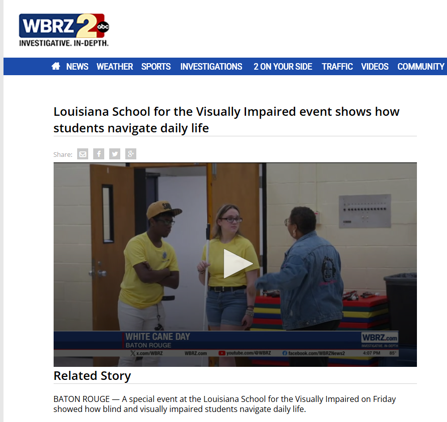 Screenshot of WBRX news page shows three participants stand in a school hallway during a White Cane Day activity at the Louisiana School for the Visually Impaired. One student holds a white cane while demonstrating independent travel and mobility skills.