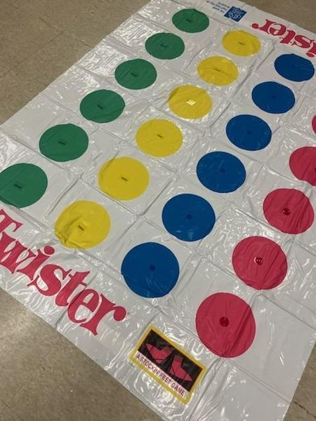 Tactile twister mat spread out on the ground