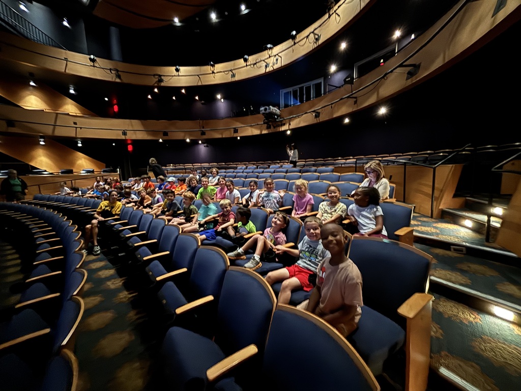 elementary students seated in Manship Theatre