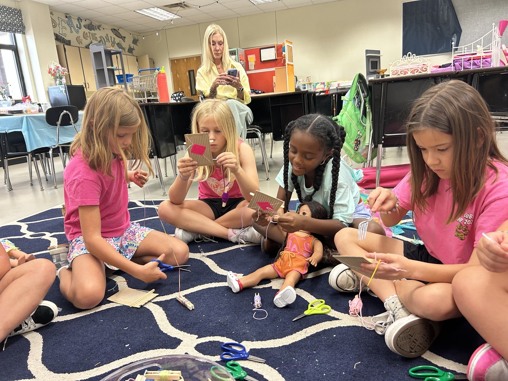 girls learning to sew doll apparel