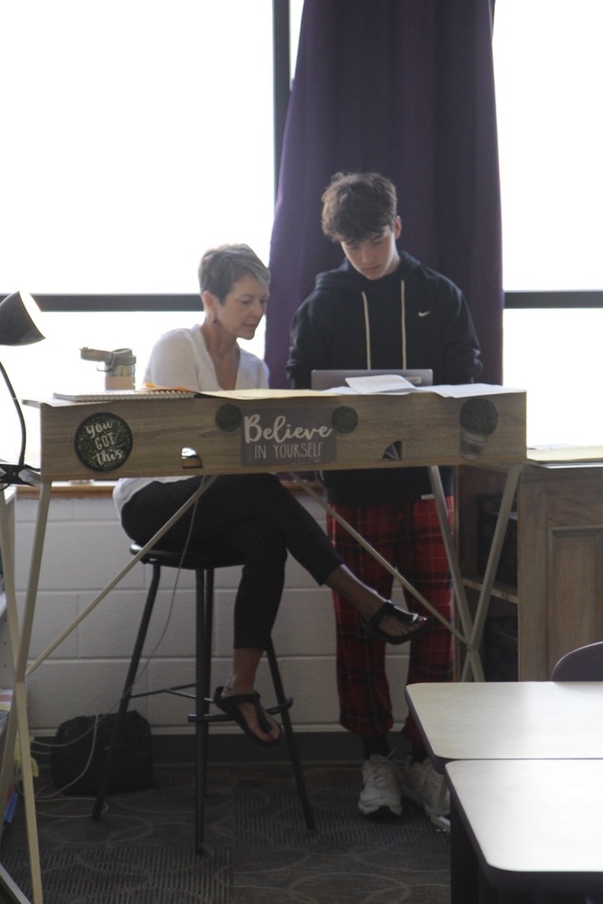 Teacher Mrs. Klein helps student Zegyn Versen with an assignment. This was taken in her new middle school classroom.