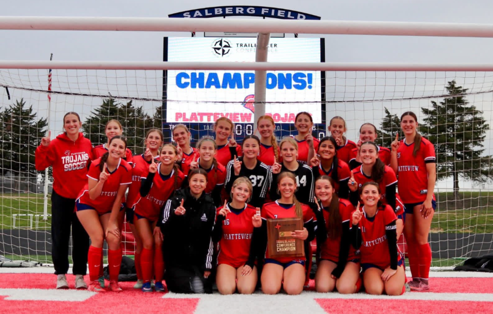 The Varsity Platteview team celebrates their victory, posing for a memorable photo after securing the conference championship