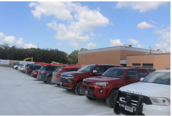 LINE 'EM UP. Cars lined up and parked in the new senior parking lot, nearest to the activities entrance.