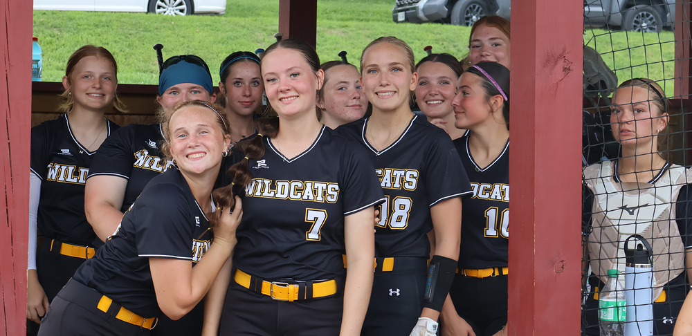 Cass Wildcats pose for a team picture before taking down Roncalli. They smile as a team as they play one of their first regular season games together.
