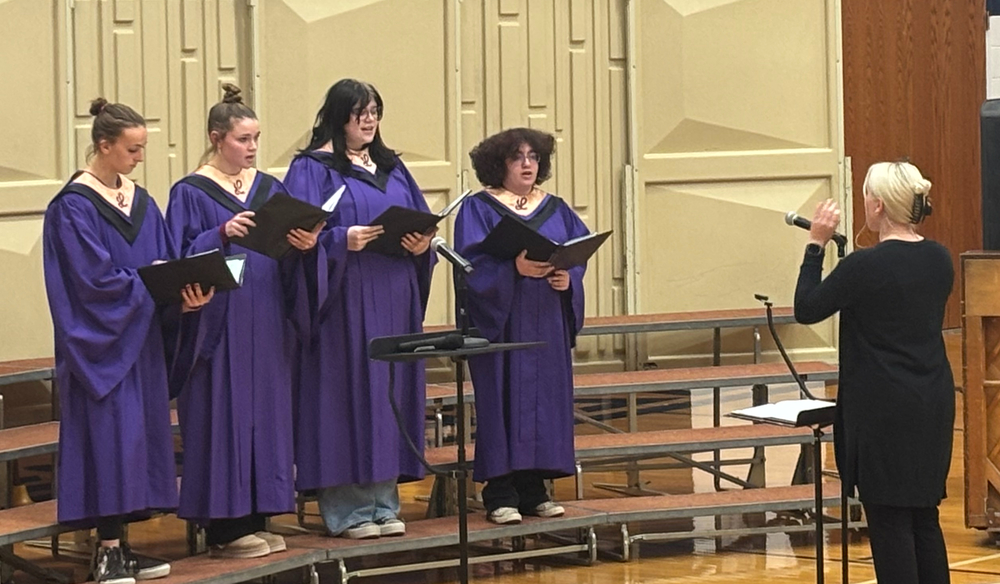 First-time teacher Ms. Rice conducting Autumn Loeffelholz, senior Lily Riha, junior Shyann Smart, and sophomore Micaiah Price at NCC choir.
