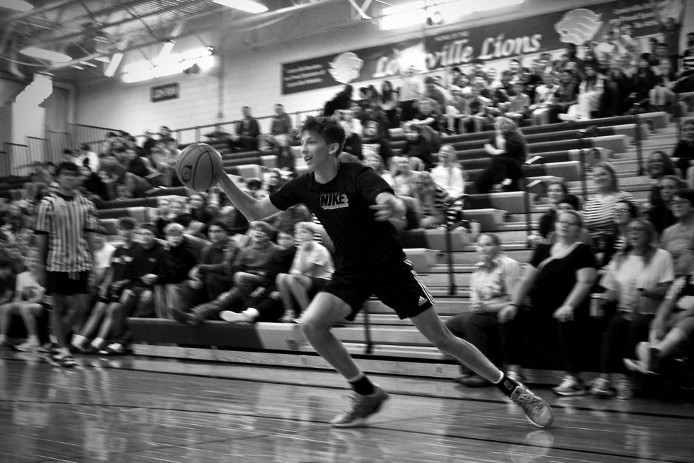 SOPHOMORE Keegan witte dribbles the ball, getting ready to score for the student and teacher team