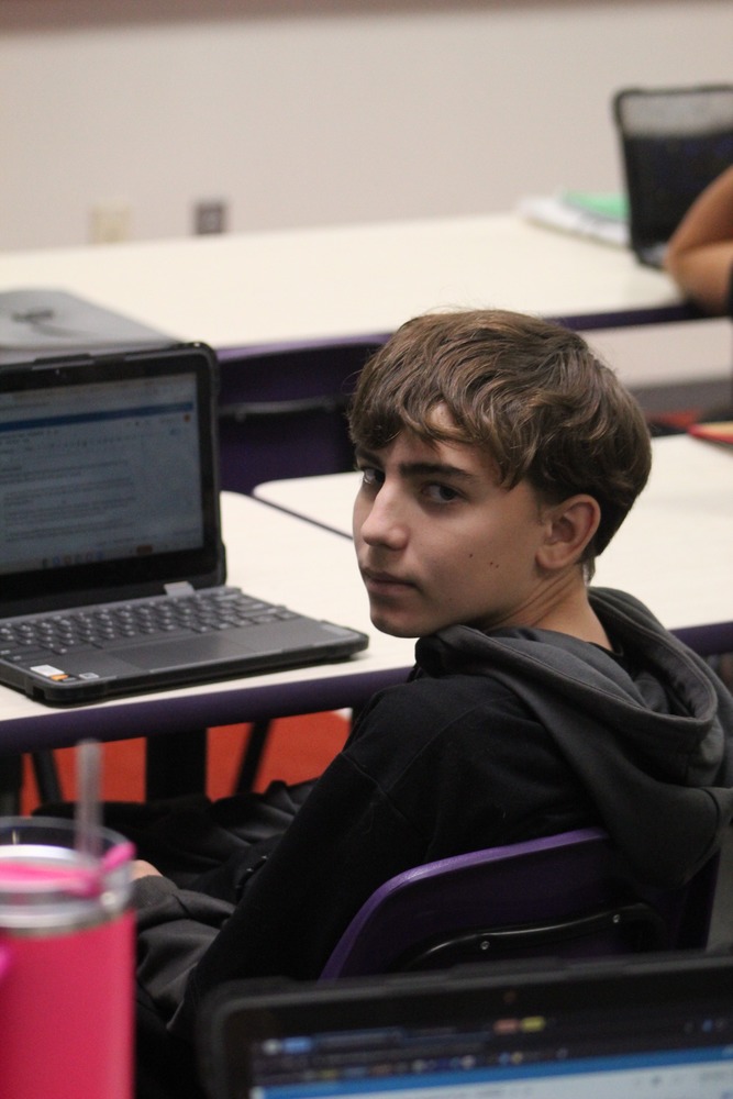 SPOTTED.Freshman Levi Sell looking at the camera. He was working on his homework until he got distracted.