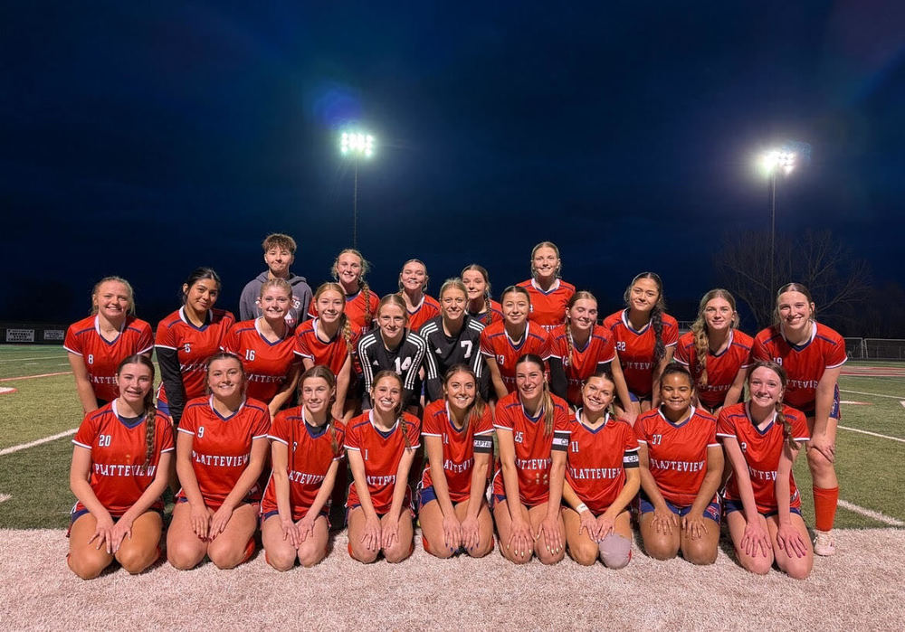FIRST TIME. The soccer team taking a  picture after the teams’ first home game. 