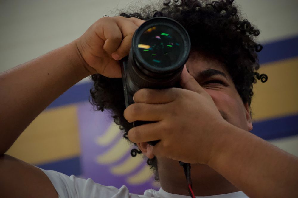 Sophmore Koltin Crandal snaps a photo. He is getting a shot for his journalism page in the yearbook.