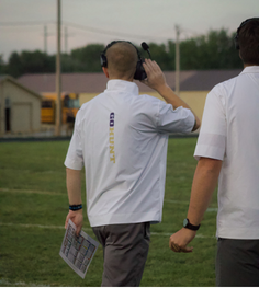 Headset Engaged. New head coach Michael Yarbrough coaching the lions during the Auburn football game.