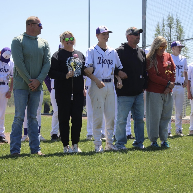 baseball player standing with his parents