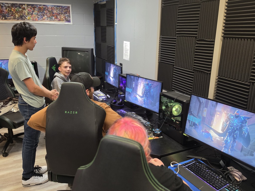 Students conversing after an esports match