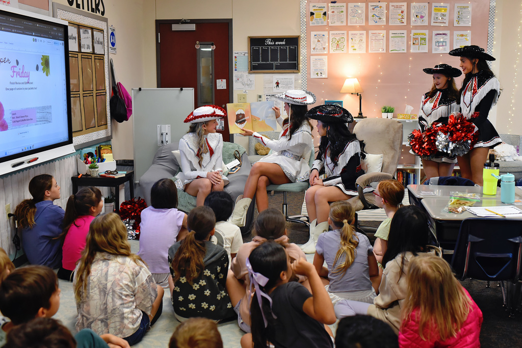 LHS Majestics, Golf, Track & Field, and Baseball programs visiting Puster Elementary for Reading with the Leopards