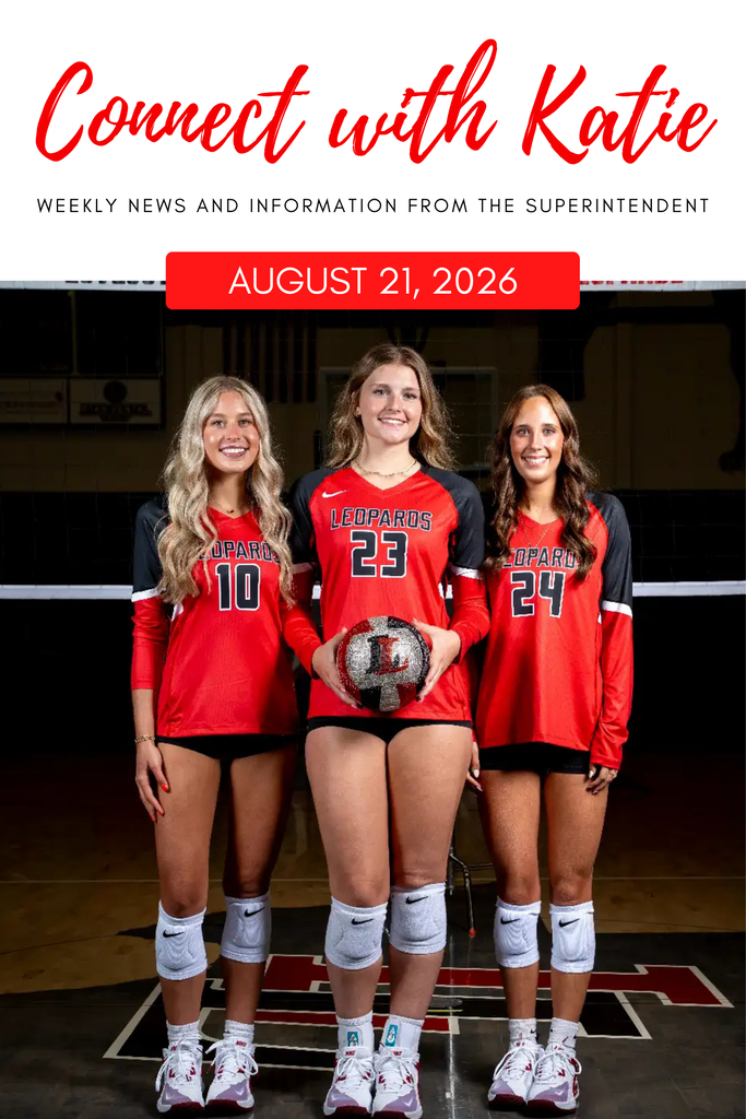 Three female volleyball players, numbers 10, 23, and 24, stand together in red uniforms. They are holding a ball and smiling.