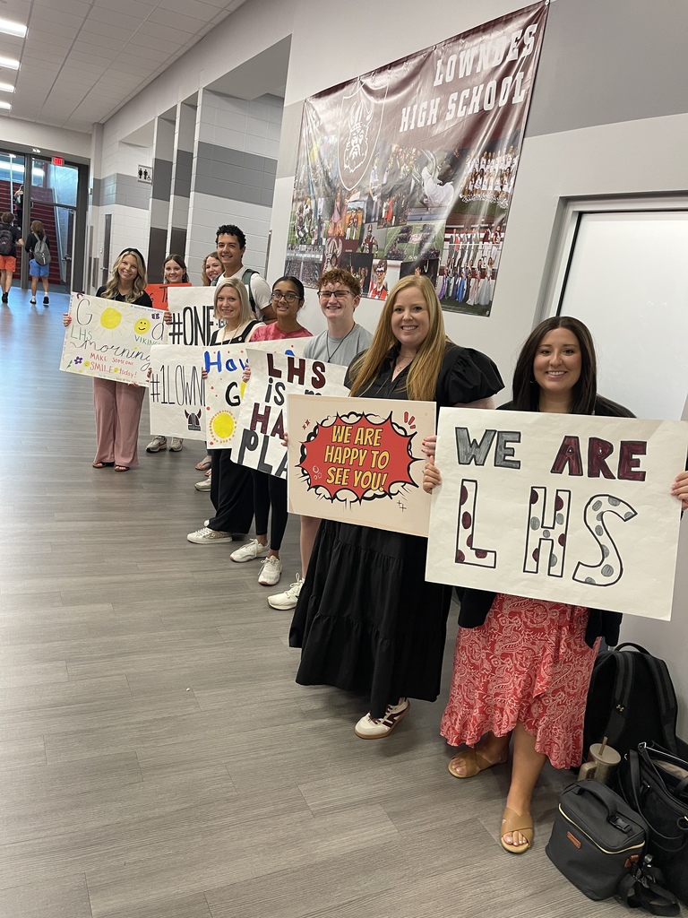 Students and teachers greeting students