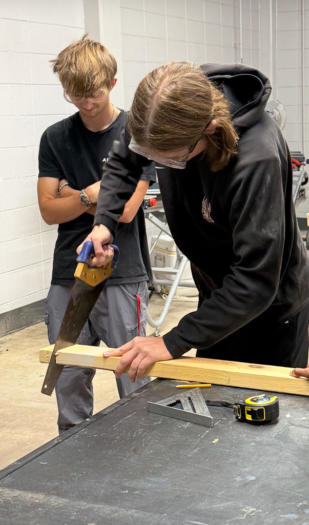 Student using handsaw