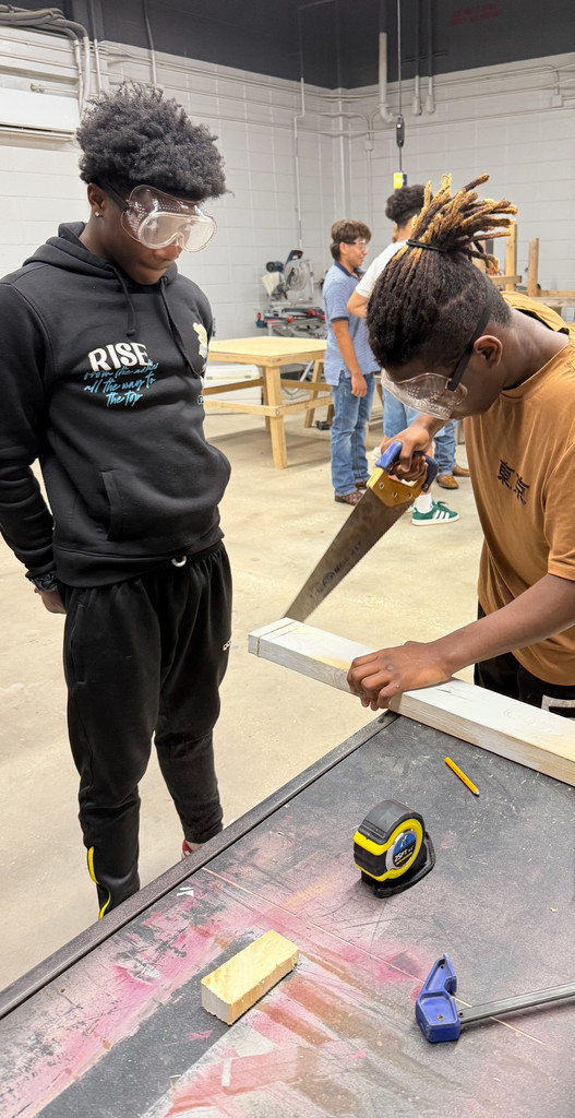 Student preparing to use hand saw