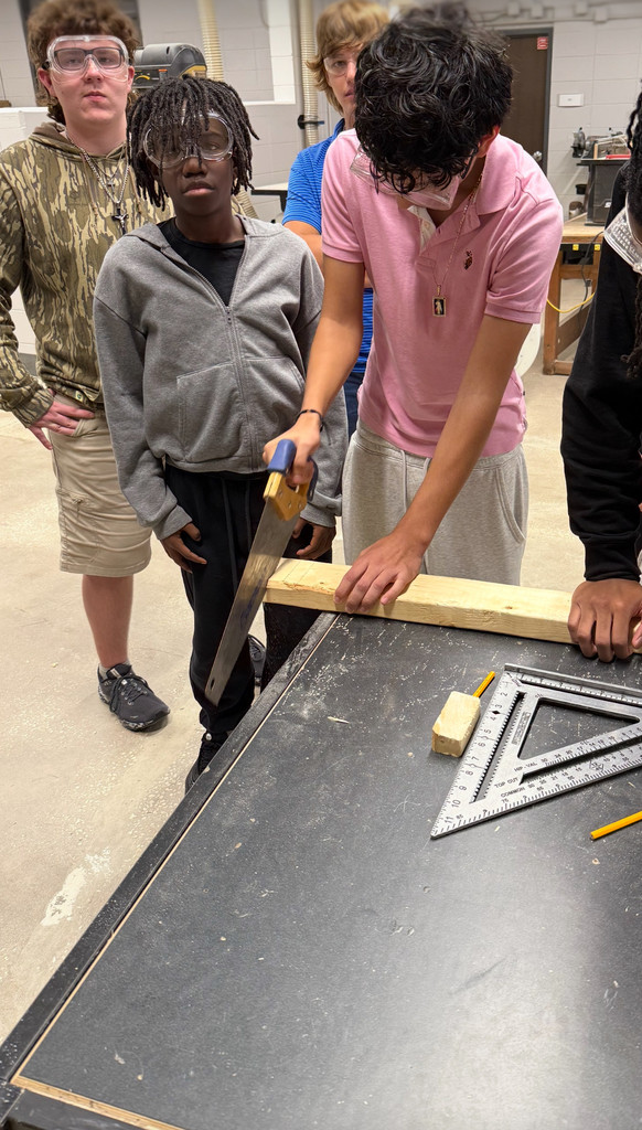 Student using handsaw