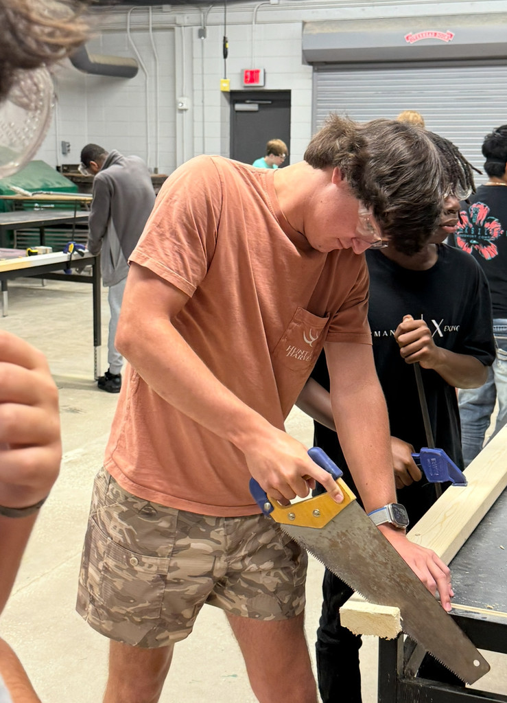 Student using handsaw