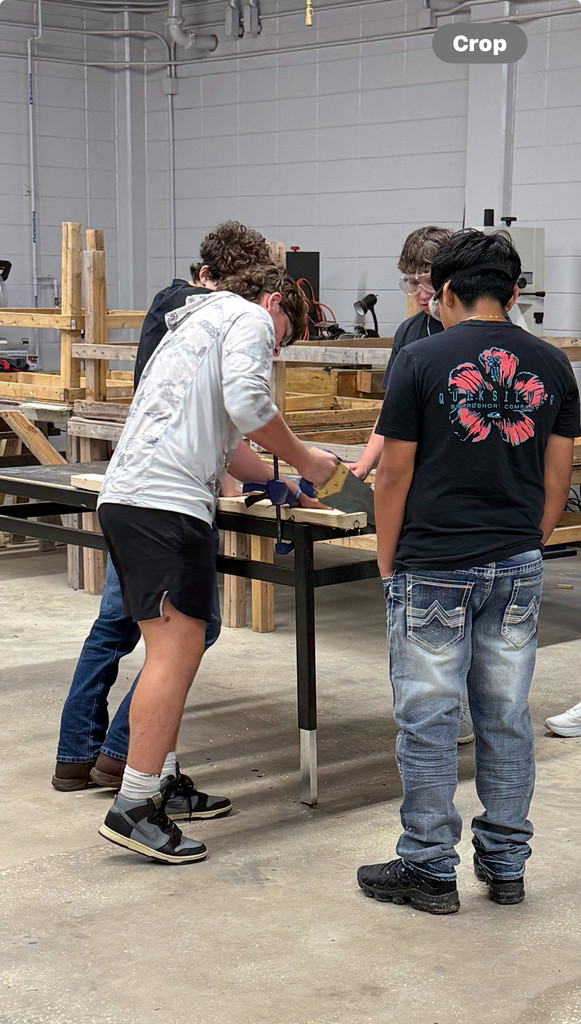 Student using handsaw