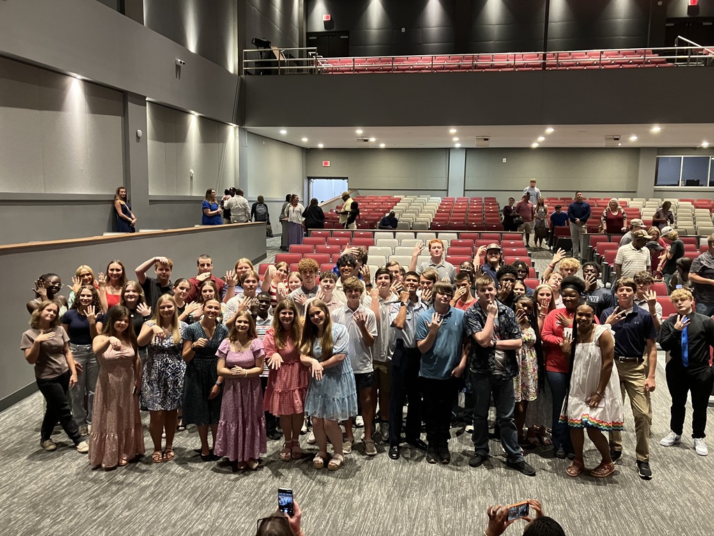 Students showing their rings after receiving them at the ring ceremony.