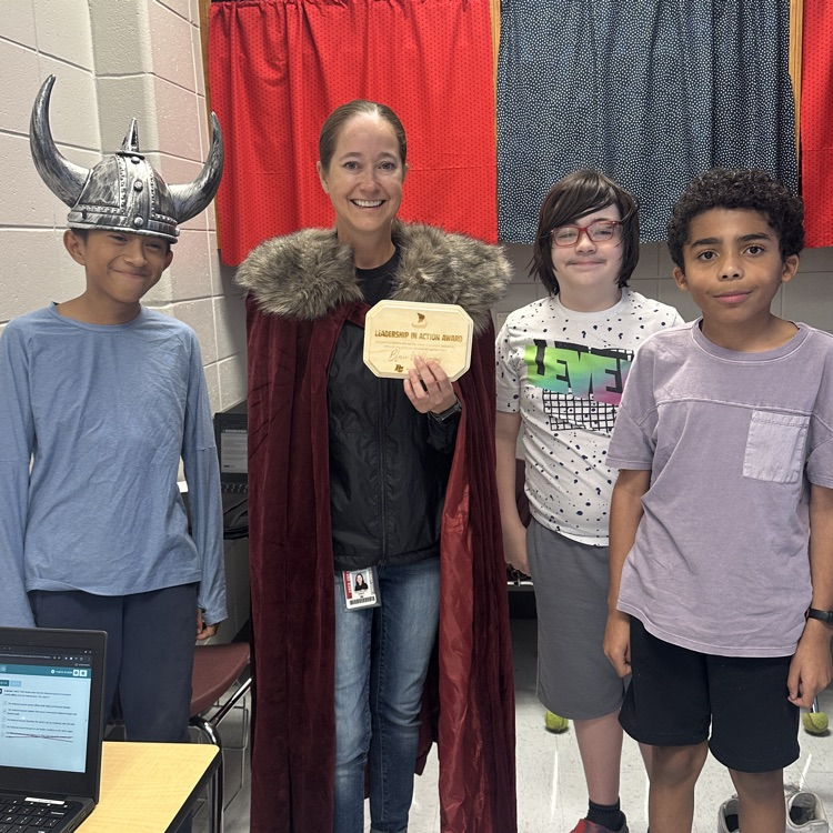 teacher posing with students