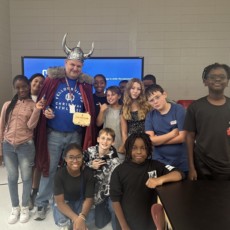 teacher posing with students