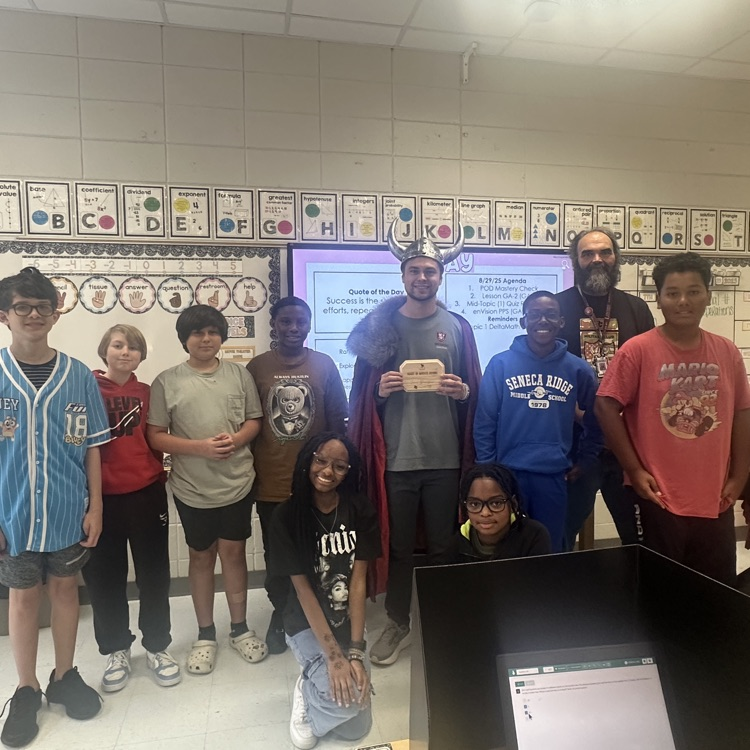 teacher posing with students