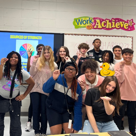 students posing with ducks