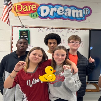 students posing with ducks