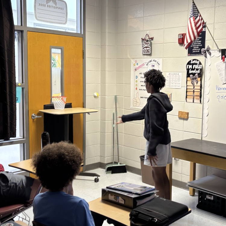 student playing trashketball