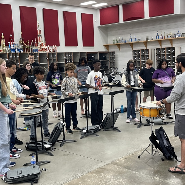 students learning their instruments
