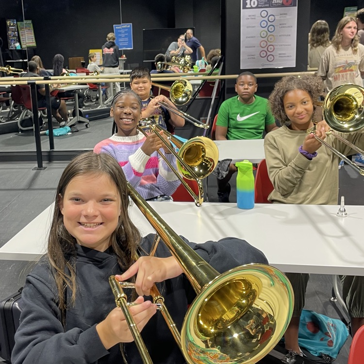 students learning their instruments