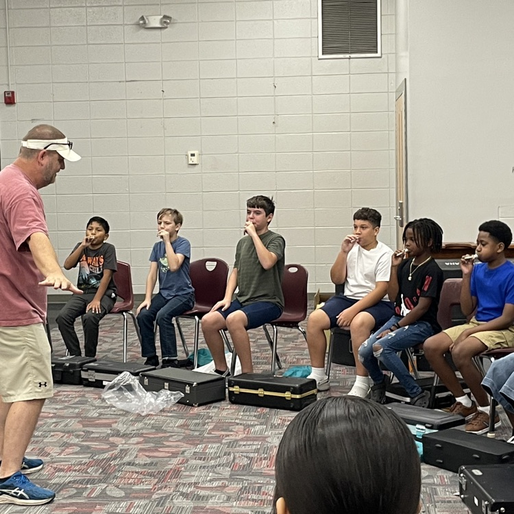 students learning their instruments