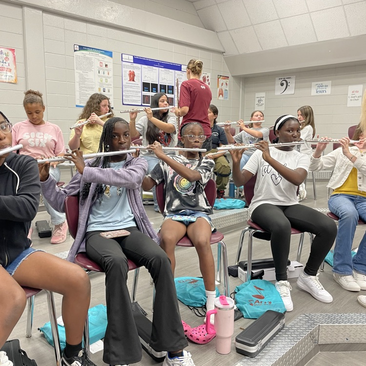 students learning their instruments