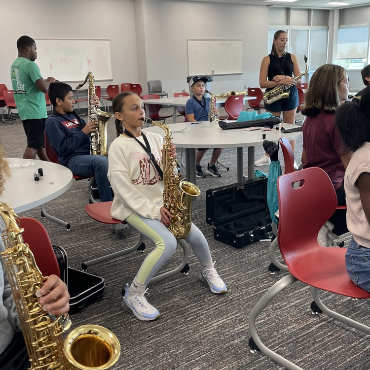 students learning their instruments