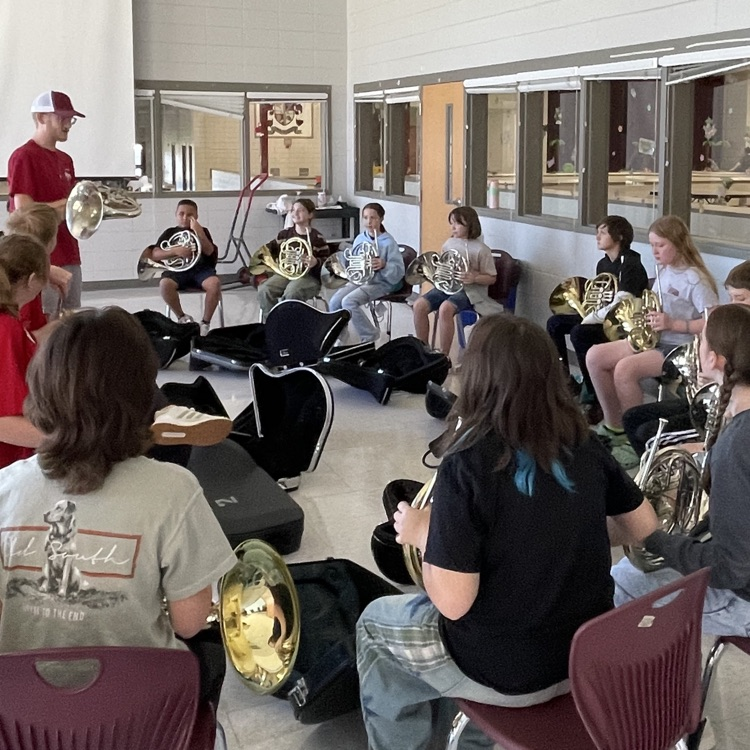 students learning their instruments