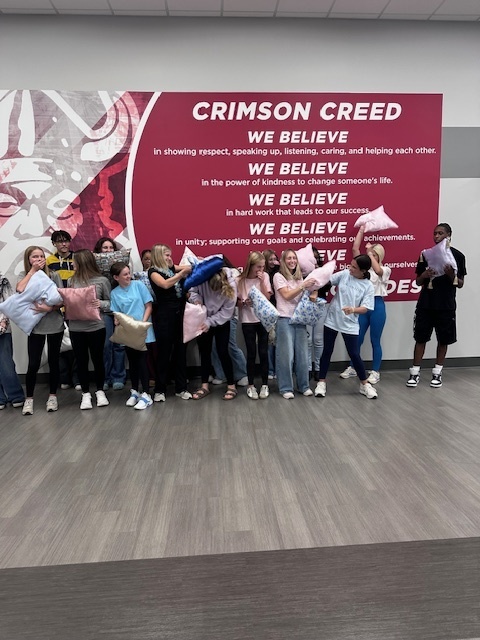 Students "pillow fighting" with the pillows they made