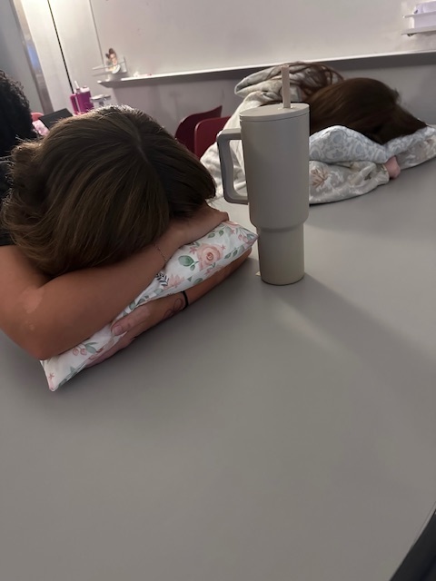 Students trying out the pillows they made