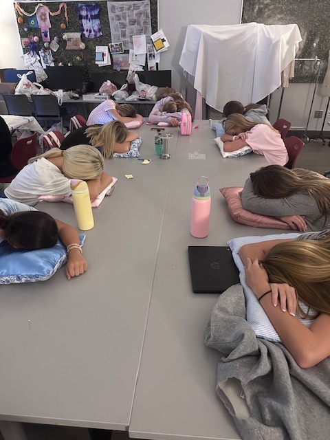 Students trying out the pillows they made