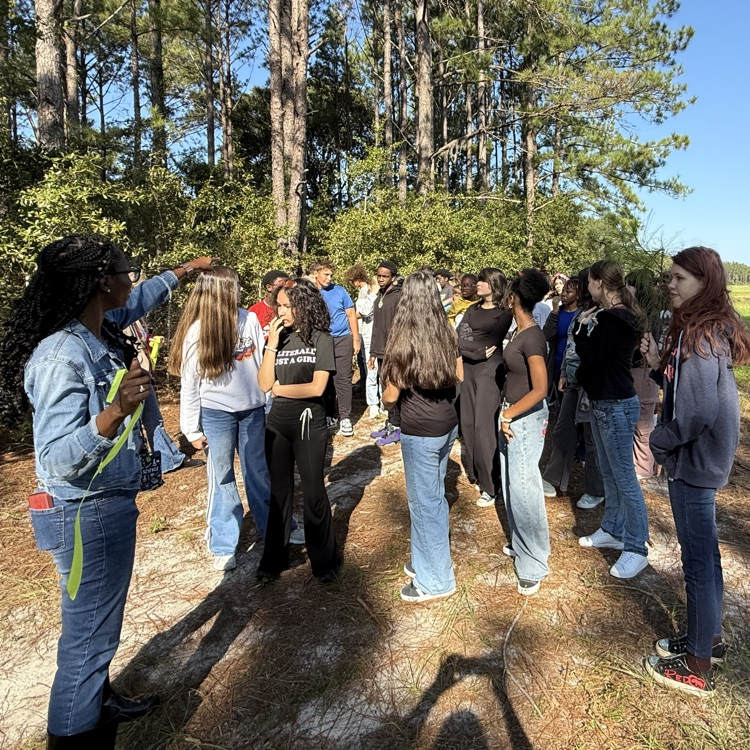 students exploring food forest
